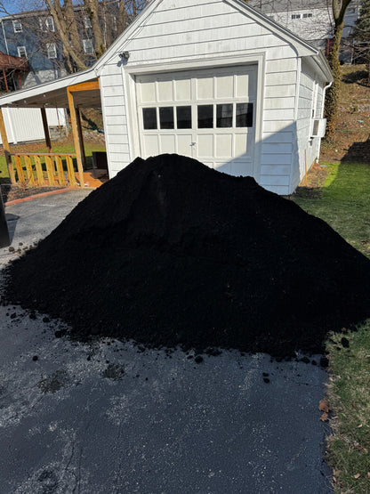 Super loam pile close-up — rich dark color and friable texture