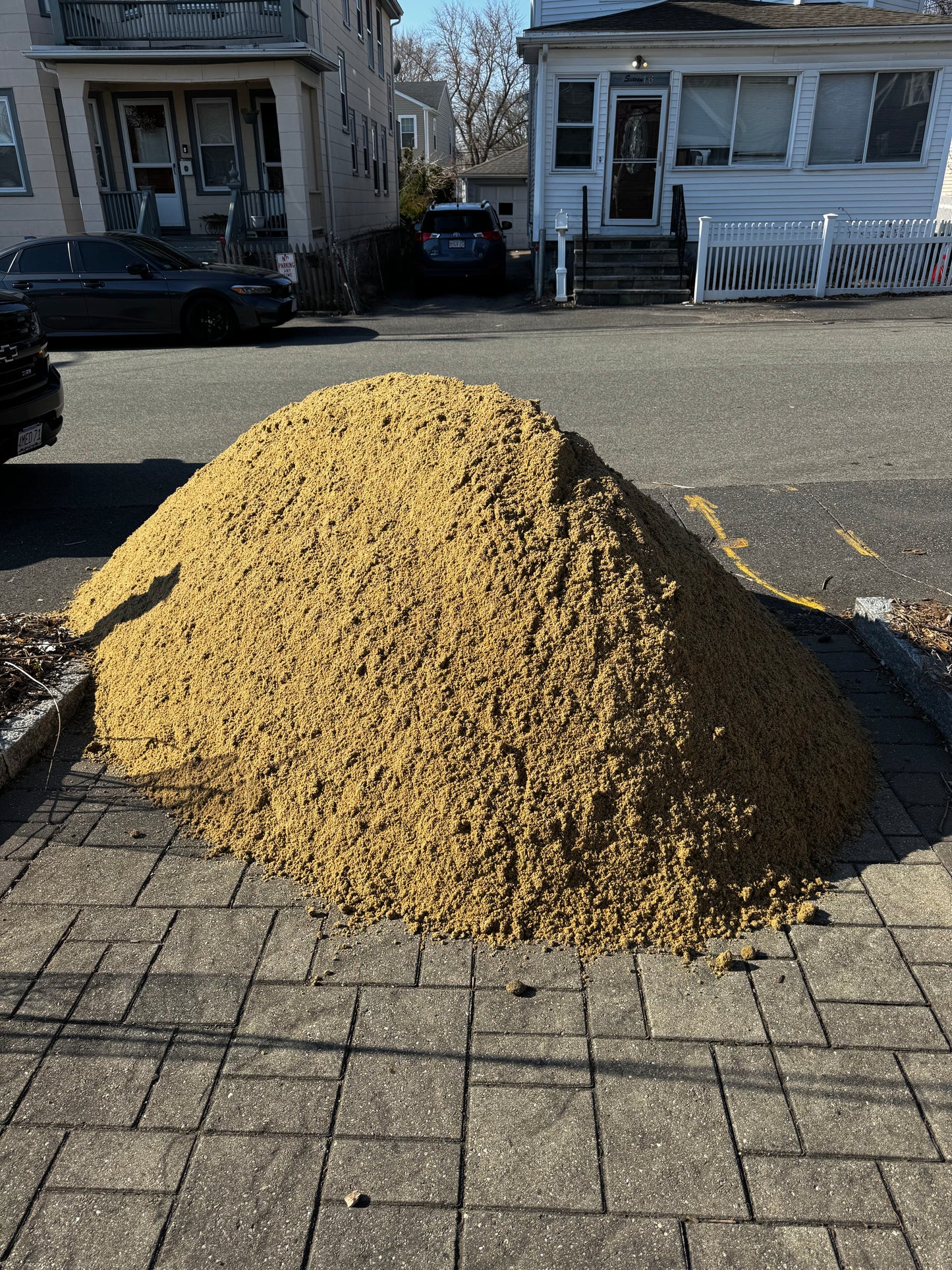 ASTM C33 concrete sand close-up — coarse, sharp washed sand