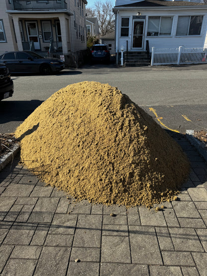 ASTM C33 concrete sand close-up — coarse, sharp washed sand